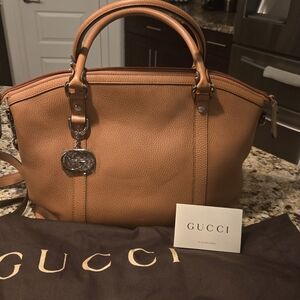 Brand New Gucci leather bag with crossbody straps.